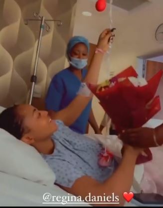Regina Daniels gets flowers from co wives as she undergoes a surgery