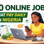 Online jobs that pay daily in Nigeria illustration showing a woman working on a laptop and phone